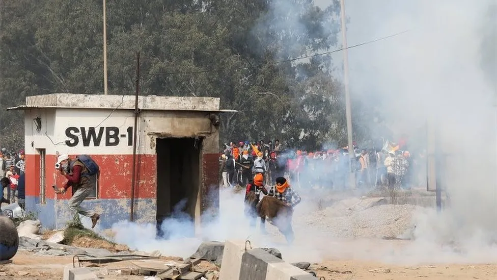 Thousands of protesters march towards the fortified city of Delhi, as tear gas is deployed during the ongoing farmers’ protest in India.